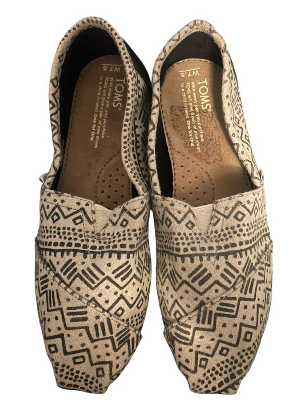 TOMS Natural Canvas Slip-Ons with Black Tribal Print